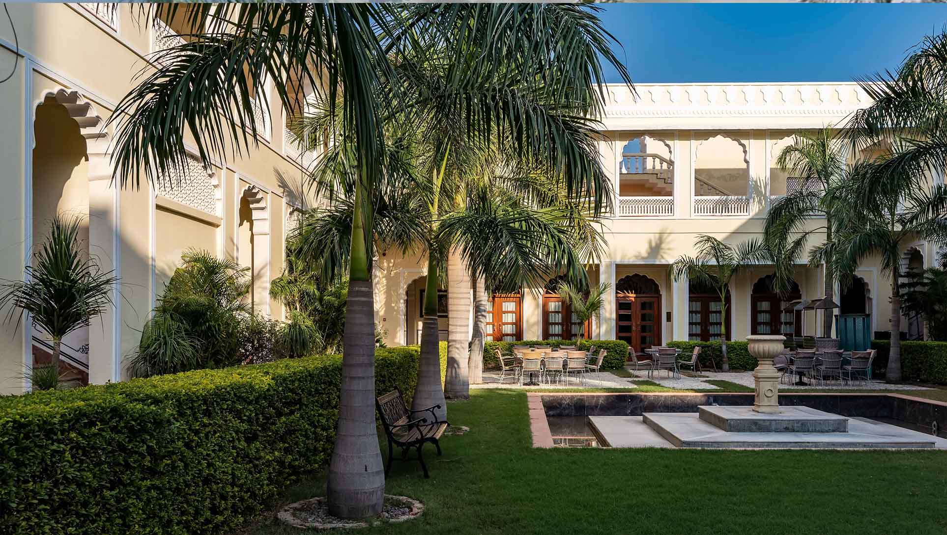 Resort-Style Courtyard with Royal Palms